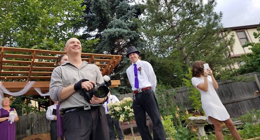 Brody Hall photographing a wedding in Denver, CO