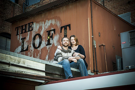 Engaged couple on a roof downtown Old Colorado City, CO