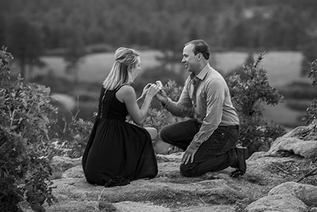 Kim kneeling, taking the ring