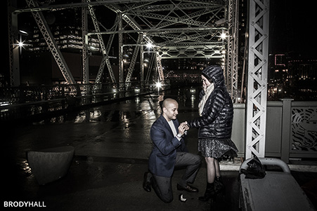 Rawood putting the ring on Paulina's finger